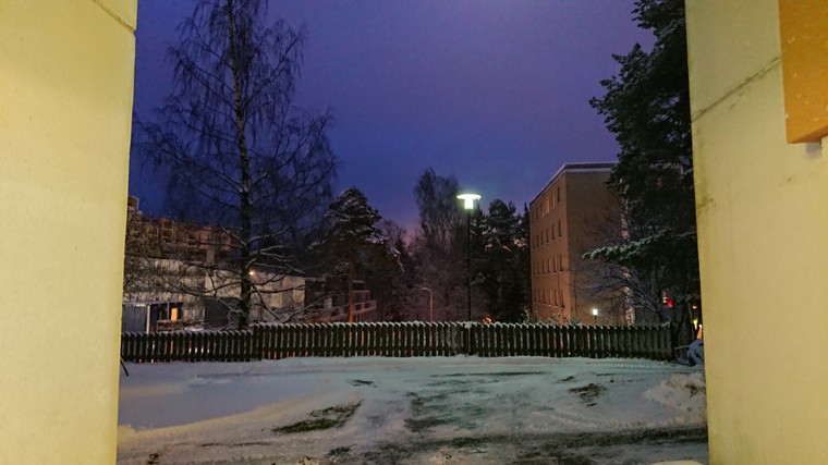 Early morning picture of sun raising against snow